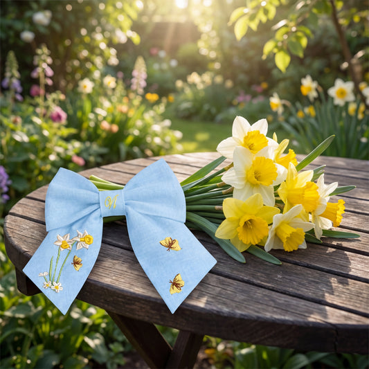 Light blue linen hair bow with floral and butterfly embroidery – handmade