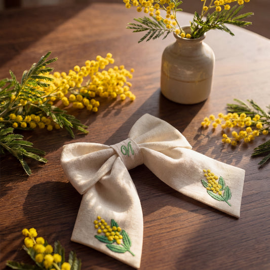 Linen hair bow with mimosa embroidery